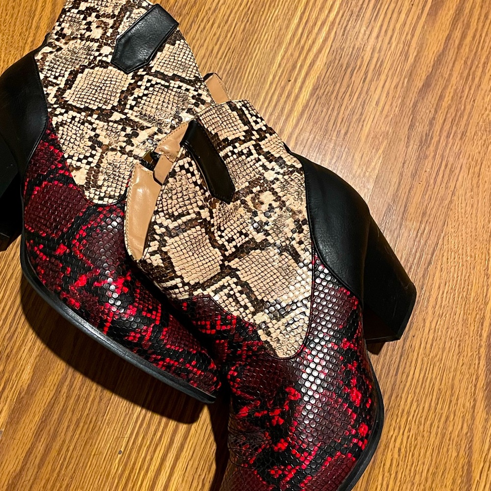 Ankle healed boots with faux snake skin black, red and white. Size 11